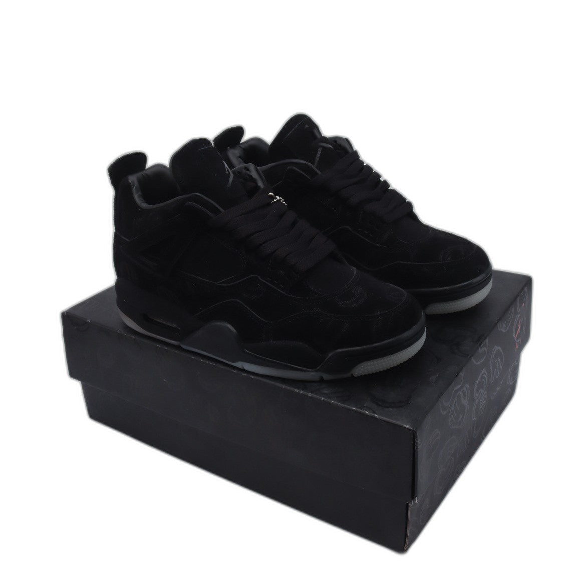 Air Jordan 4 x KAWS Black - SUELA ILUMINOSA