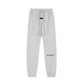 Pantalón Buzo ESSENTIALS gris claro