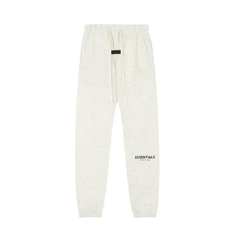 Pantalón Buzo ESSENTIALS gris avena